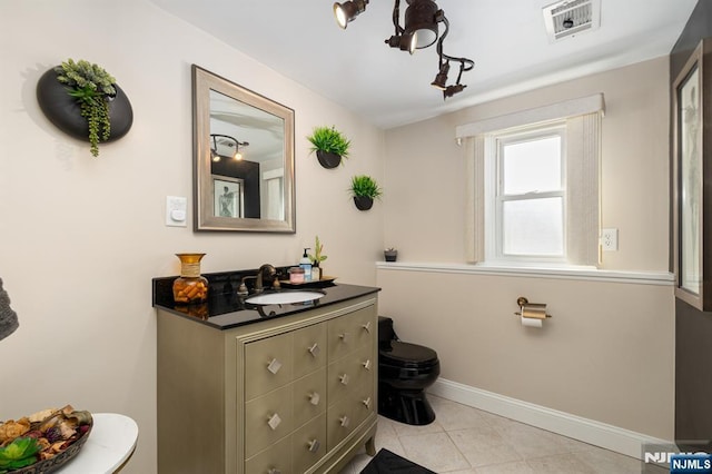 bathroom with visible vents, baseboards, toilet, tile patterned floors, and vanity