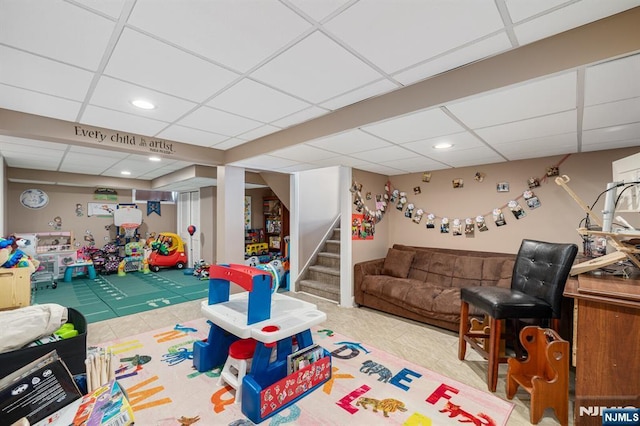 recreation room featuring recessed lighting, a paneled ceiling, and tile patterned floors