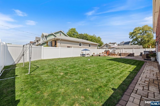 view of yard featuring a patio and a fenced backyard