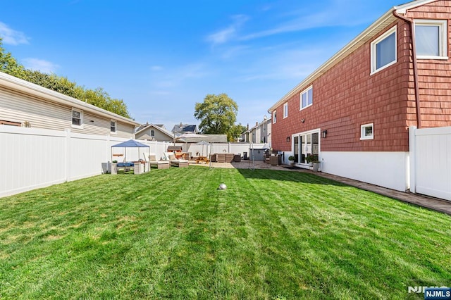 view of yard with a patio and a fenced backyard