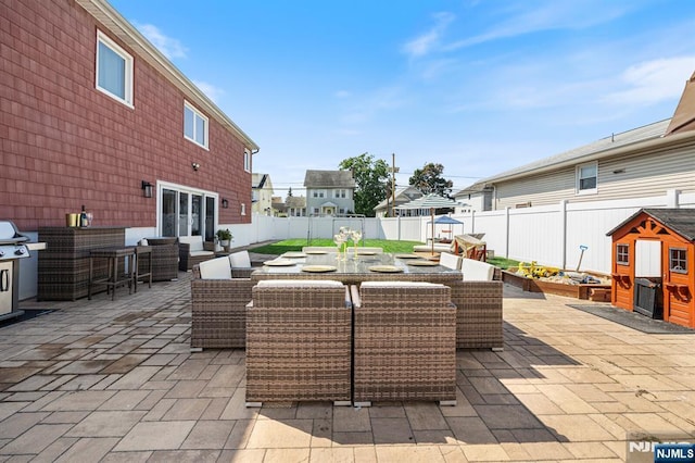 view of patio / terrace featuring an outdoor hangout area, a fenced backyard, and outdoor dining space