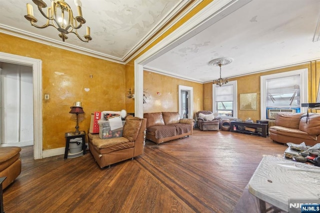 living room with wood finished floors, a chandelier, and crown molding