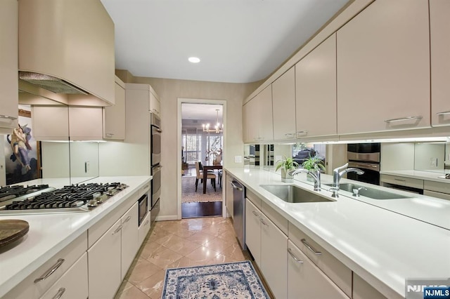 kitchen with appliances with stainless steel finishes, light countertops, a sink, and custom exhaust hood