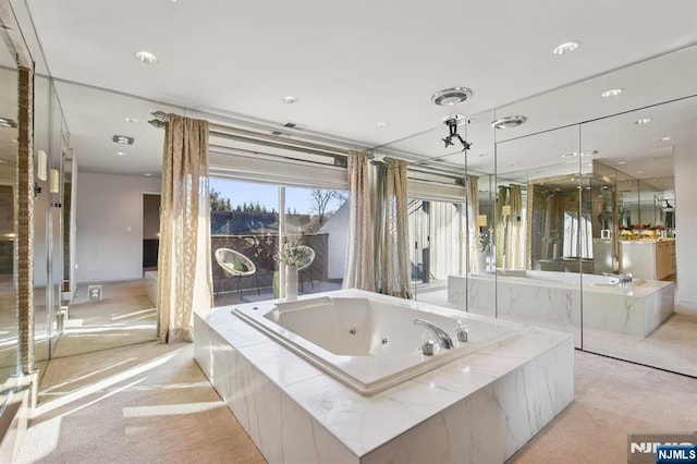 bathroom featuring a whirlpool tub