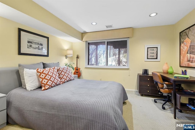 carpeted bedroom with baseboards, visible vents, and recessed lighting