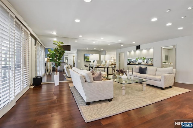 living area with wood finished floors and recessed lighting