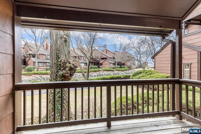 wooden deck featuring a residential view