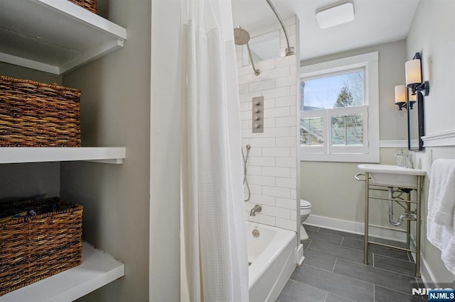 full bath with toilet, baseboards, and tile patterned floors