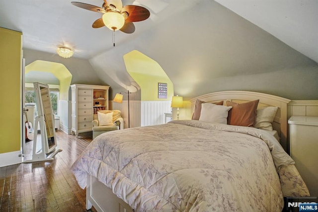 bedroom featuring a ceiling fan, wood-type flooring, and vaulted ceiling