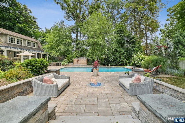 view of pool featuring a fenced in pool, a patio area, and a fenced backyard