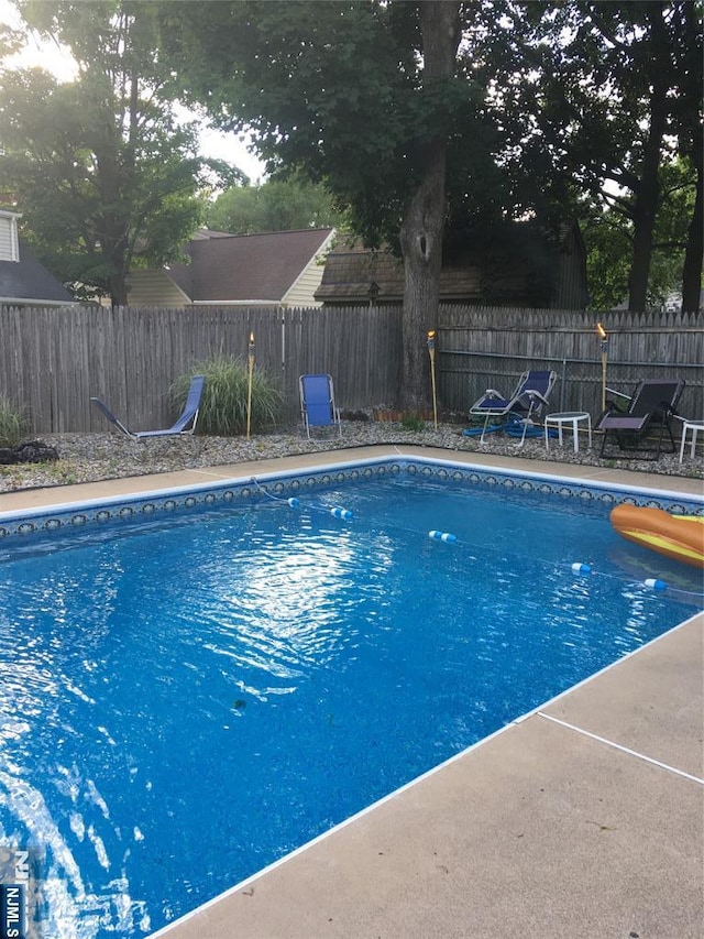 view of pool featuring a fenced in pool, a patio, and a fenced backyard