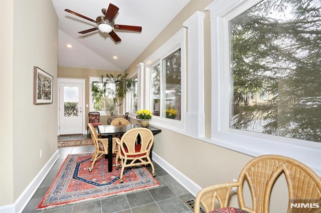 sunroom / solarium featuring ceiling fan and vaulted ceiling