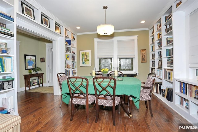 dining space with built in features, ornamental molding, wood finished floors, and recessed lighting