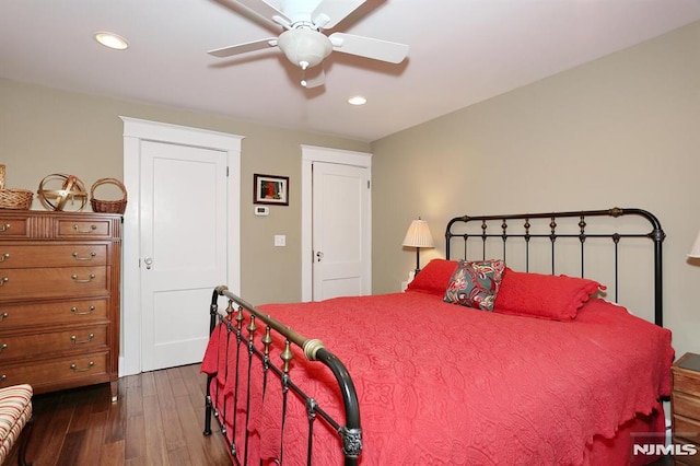 bedroom featuring dark wood finished floors, a ceiling fan, and recessed lighting