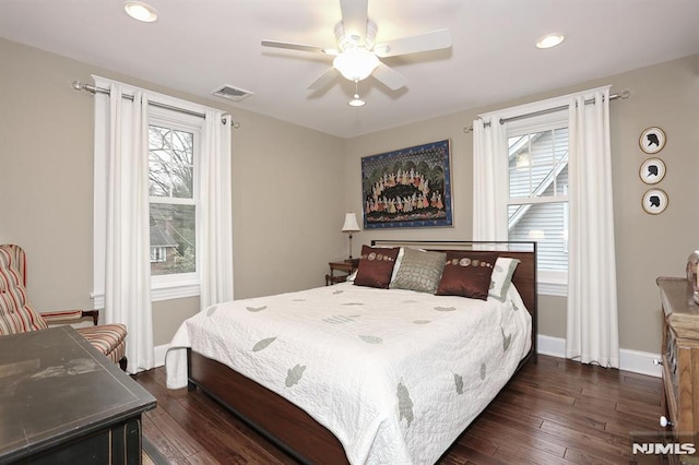 bedroom featuring recessed lighting, visible vents, dark wood finished floors, and baseboards