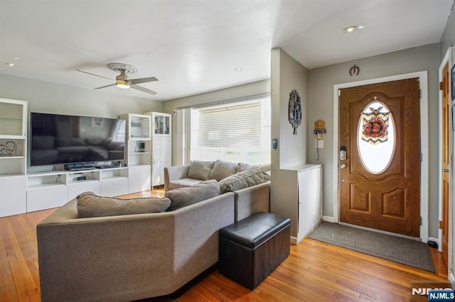 interior space featuring a ceiling fan and hardwood / wood-style floors