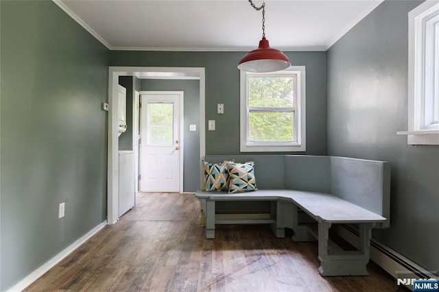 mudroom featuring a baseboard radiator, crown molding, baseboards, and wood finished floors