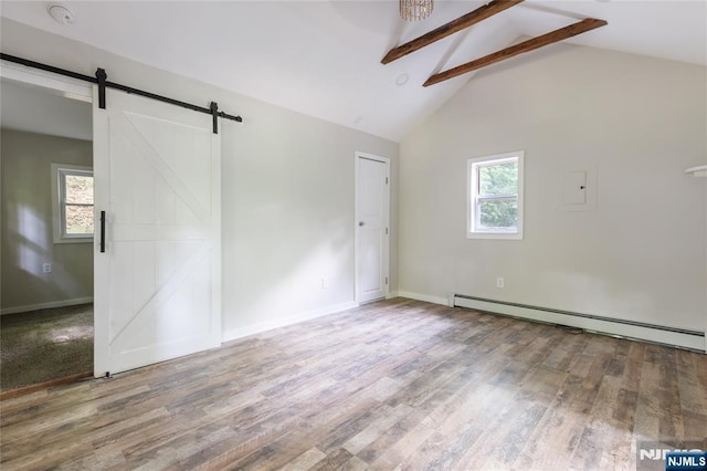 empty room with a barn door, wood finished floors, a baseboard heating unit, high vaulted ceiling, and beam ceiling