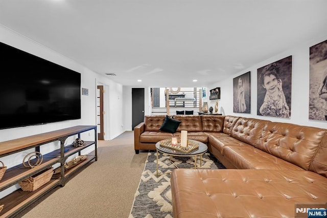 living area featuring recessed lighting and light colored carpet