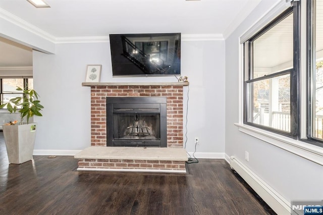 room details with baseboard heating, a brick fireplace, wood finished floors, and crown molding