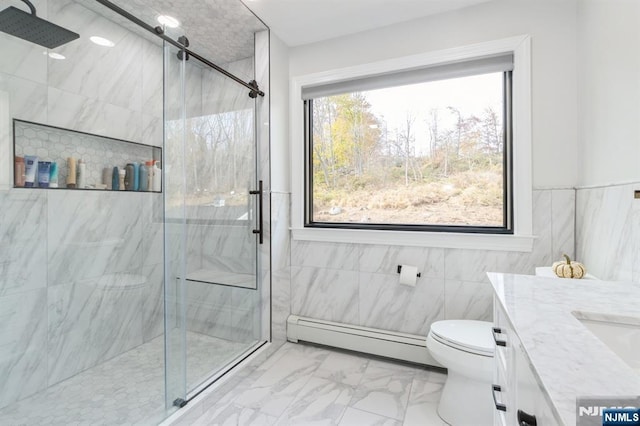 full bathroom with marble finish floor, toilet, baseboard heating, a shower stall, and vanity