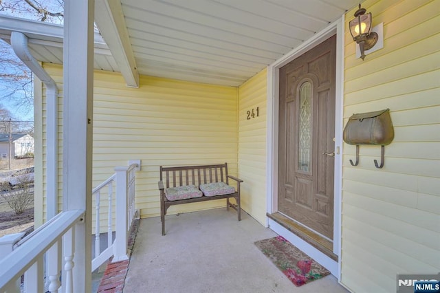 entrance to property with covered porch