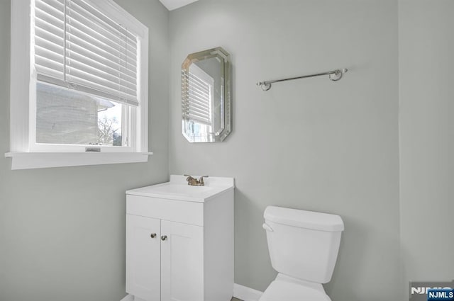 bathroom with toilet and vanity