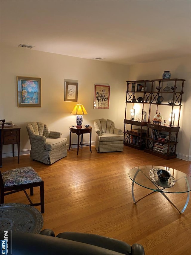 living room with wood finished floors and baseboards