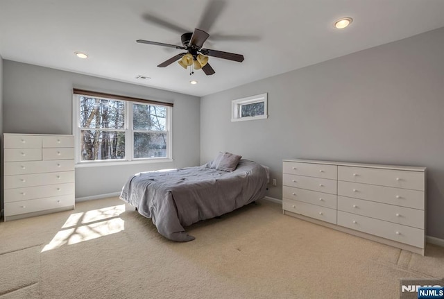 bedroom featuring recessed lighting, visible vents, baseboards, and light carpet