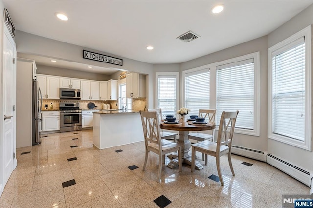 dining room featuring recessed lighting, visible vents, and granite finish floor