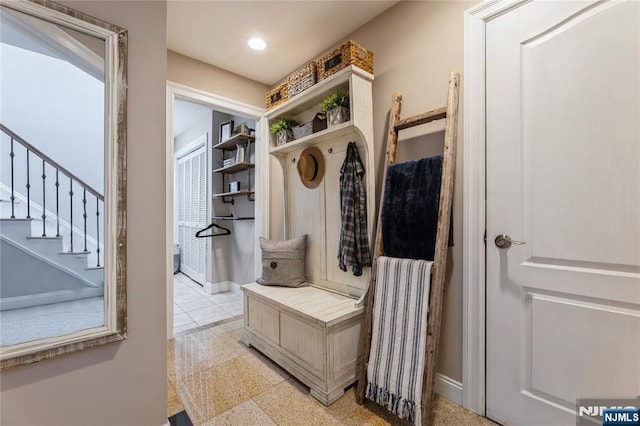 mudroom with baseboards and recessed lighting