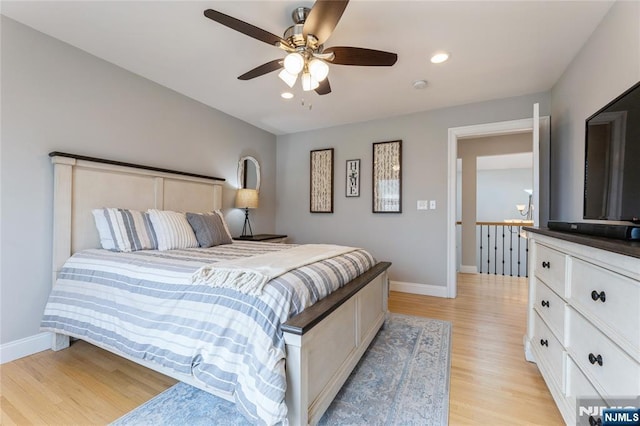 bedroom with recessed lighting, ceiling fan, light wood-style flooring, and baseboards