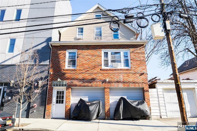 exterior space with brick siding and an attached garage