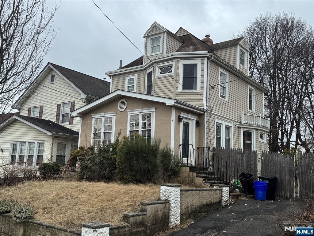 view of front of property with fence