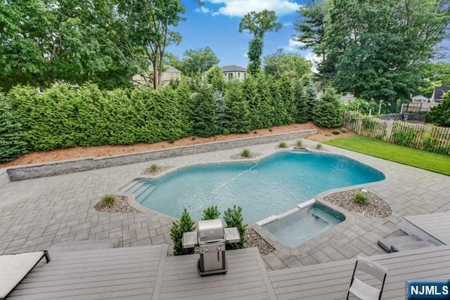 view of pool featuring a fenced in pool, a fenced backyard, and a patio