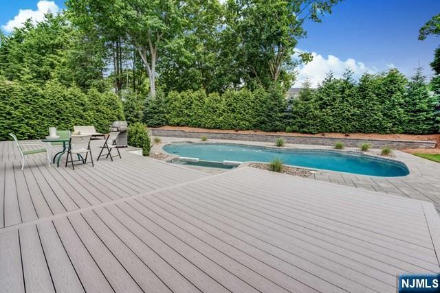 outdoor pool with a deck