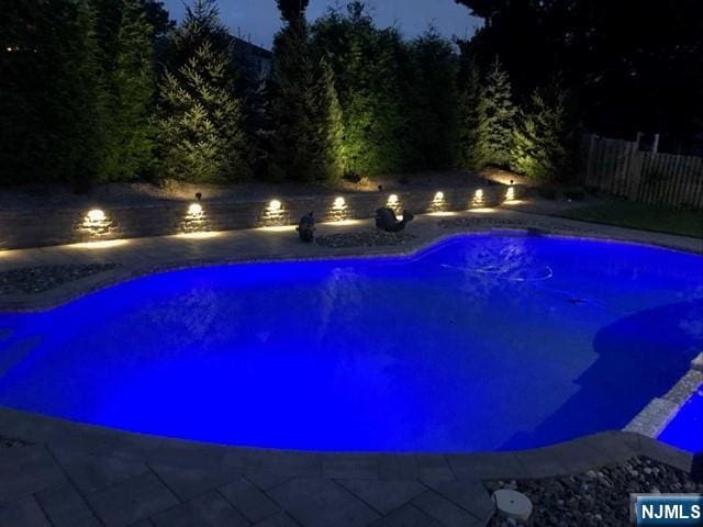 view of pool with fence and a fenced in pool