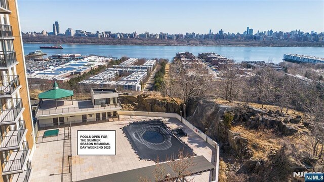 bird's eye view featuring a view of city and a water view