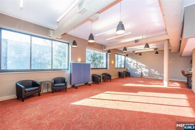 interior space with visible vents, baseboards, and carpet floors