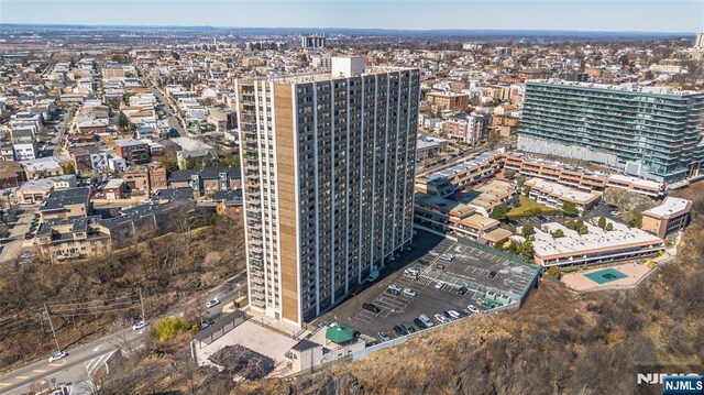 birds eye view of property featuring a city view