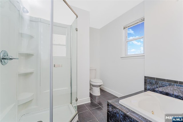 full bath with a stall shower, baseboards, toilet, tile patterned floors, and a bath