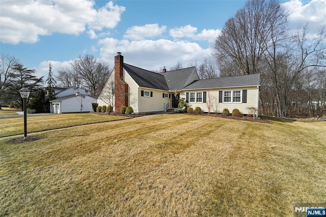 ranch-style house featuring a chimney and a front lawn