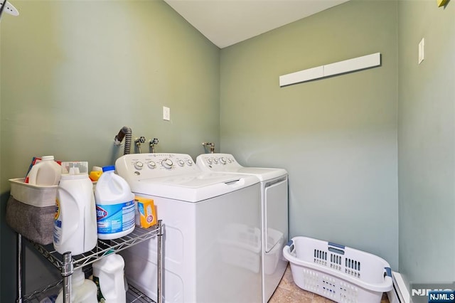 washroom featuring laundry area, washer and clothes dryer, and baseboard heating