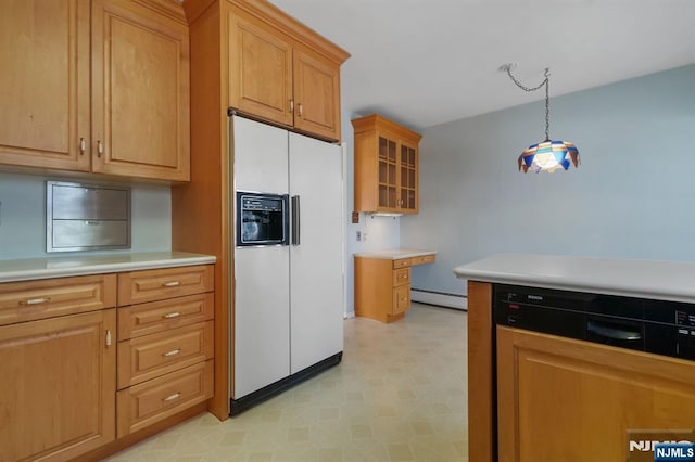 kitchen featuring white refrigerator with ice dispenser, decorative light fixtures, light countertops, light floors, and a baseboard heating unit