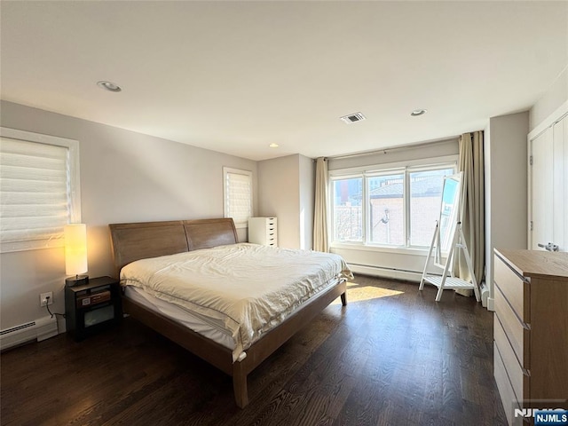 bedroom featuring dark wood-type flooring, visible vents, and recessed lighting