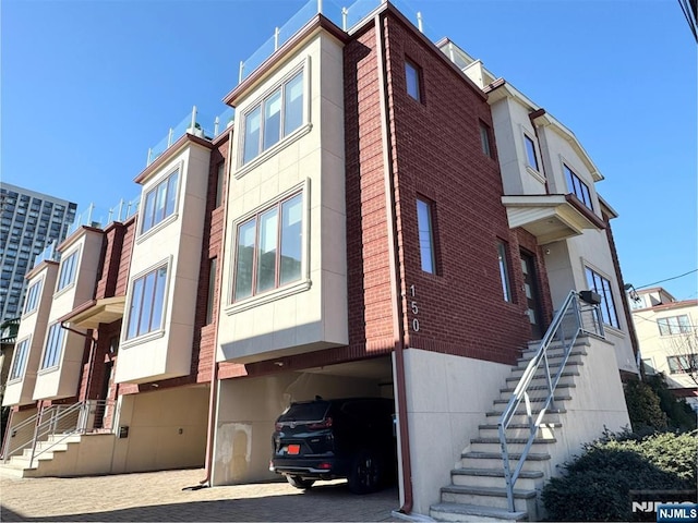 view of property featuring stairs