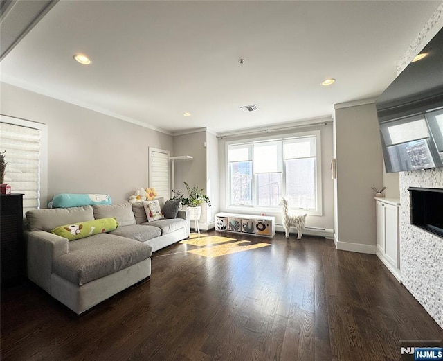 living room featuring a fireplace, visible vents, dark wood-type flooring, and recessed lighting