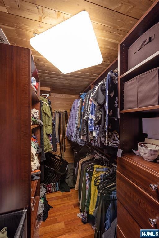 spacious closet featuring wood finished floors