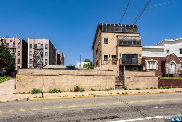 view of building exterior featuring fence