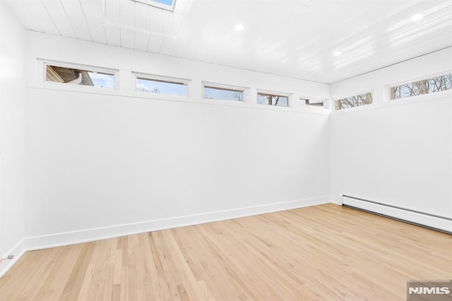 unfurnished room with recessed lighting, wooden ceiling, wood finished floors, and baseboards